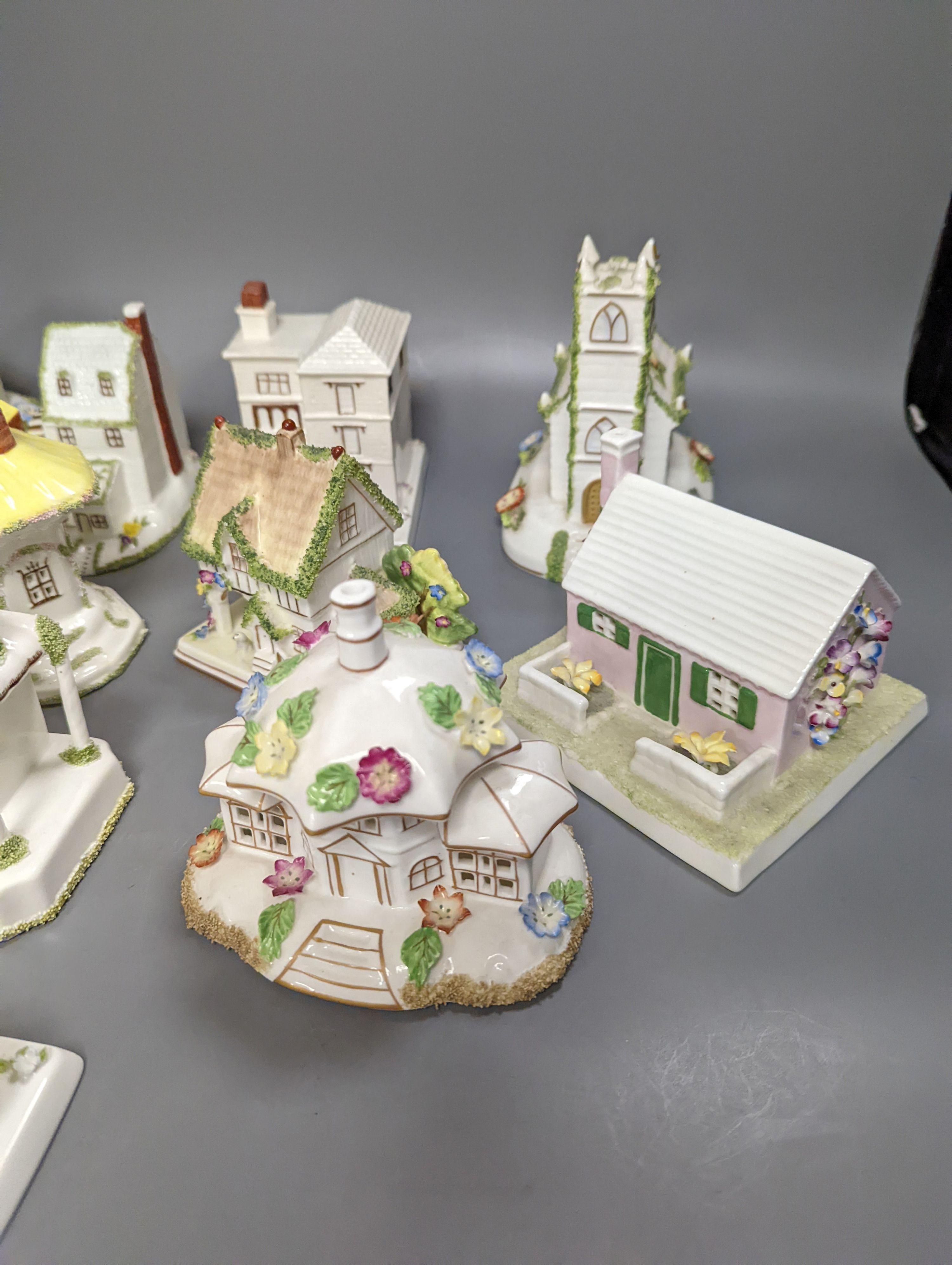 Twelve Coalport bone china pastille burner cottages and other buildings, tallest 14cms high